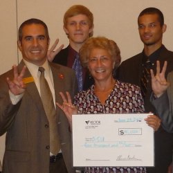 Elaine Stover of Arizona State University's Career Services center accepts a Vector Marketing College Bowl check.